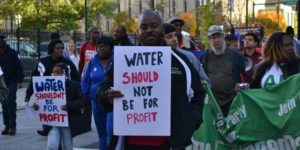 Protester supporting public water