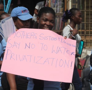 Veronica Nwanya, an organizer with our longtime ally Environmental Rights Action, leads a women’s march for water justice in Lagos, Nigeria, as part of our joint campaign for a strong, public water system in the city. CREDIT: Environmental Rights Action