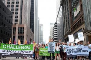 Corporate Accountability International staff march with Rainforest Action Network" down 6th Avenue