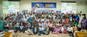 Nearly 150 attendees stood together at the National Water Summit in Abuja, Nigeria. CREDIT: BABAWALE OBAYANJU