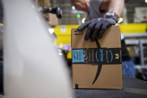 Amazon worker holding a box