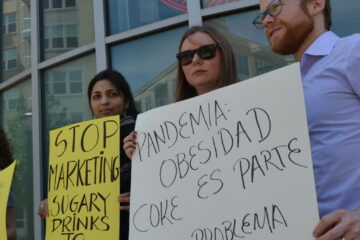Organizers protest Coca-Cola’s marketing practices and political influence outside of the corporation’s headquarters.